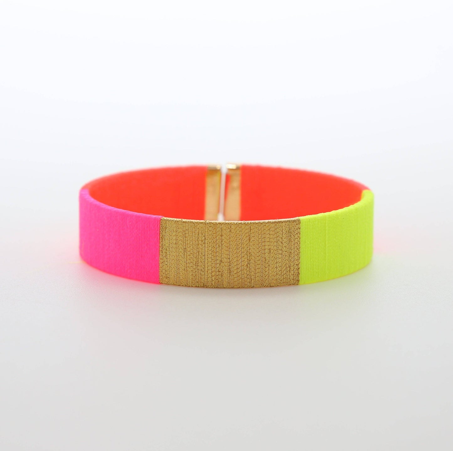 Tao Armreif in fluoreszierendem Gelb, Pink und Orange